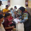 Wali Kota Bandar Lampung Serahkan Bantuan Beras dan Santunan Disabilitas di Kemah Bakti Satlinmas